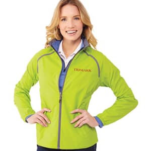 A woman wearing a bright lime green packable rain jacket with a blue collar and a logo on the chest.