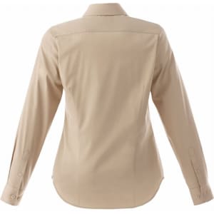 A women's long sleeve button-up shirt in a light beige colour, featuring a back yoke and cuffs, with a logo.