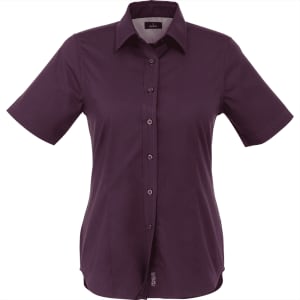 A short sleeve women's button-up shirt in a deep purple shade, featuring a collar and a logo.