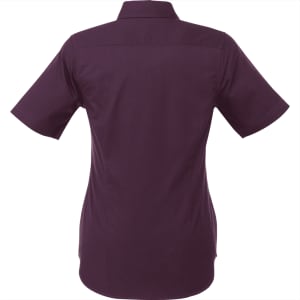 A women's short sleeve button-up shirt in a deep purple colour, featuring a back yoke and collar, with a logo.