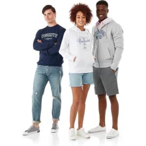 A group of three models wears hoodies in navy, white, and grey, standing against a light background.