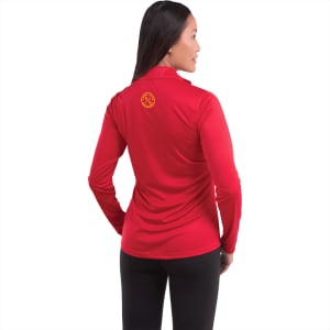 A woman wearing a red long-sleeve half zip jacket, featuring a logo on the back.