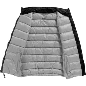 A black insulated vest for women, featuring a grey interior and a zippered front. It has pockets and a logo.