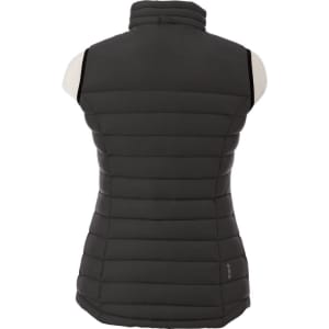 A women's down vest in dark grey, featuring a zip-up design and puffy quilted texture. Includes a logo on the side.