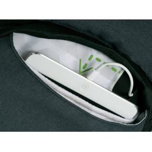 A green backpack features a white item in a pocket, with a visible charging cable. The interior has a geometric pattern.