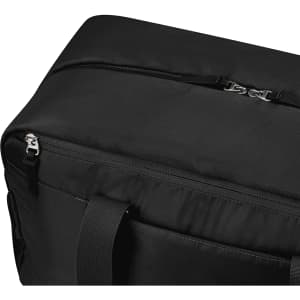 A black duffle bag featuring a zip closure and sturdy handles, with a logo present on the design.