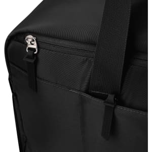 A black duffle bag corner with zippers and webbing straps, featuring a subtle logo on the surface.