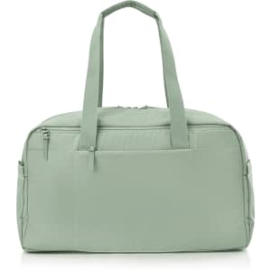 A green duffle bag with two handles and a zipper closure, featuring a logo on the front.
