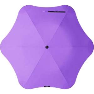 A purple BLUNT Metro Umbrella with a unique octagonal shape and a central button. The umbrella features a branding logo.