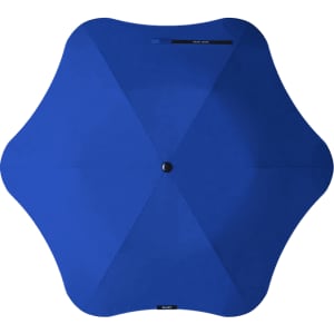 A blue BLUNT Metro Umbrella with a unique six-pointed design, featuring a central button.