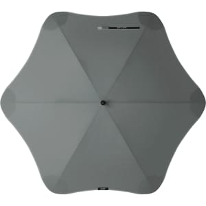 A grey BLUNT Classic Umbrella with a unique star-like shape and a central button. It features a logo.