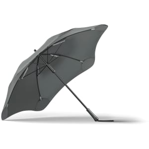A grey BLUNT Classic Umbrella with a sleek design and a sturdy base, featuring a logo on the handle.