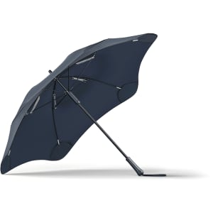 A navy blue BLUNT Classic Umbrella with a unique canopy shape, featuring a sturdy black frame and a logo.