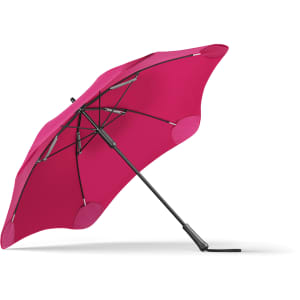 A fuchsia umbrella with a curved canopy and a black frame, featuring a logo on the handle.