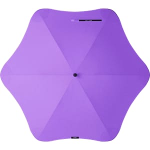A purple BLUNT Classic Umbrella with a unique star-shaped canopy and a central hub. It features branding on the handle.