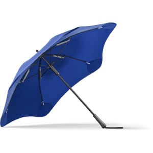 A blue BLUNT Classic Umbrella featuring a unique, aerodynamic shape and a sturdy black handle.