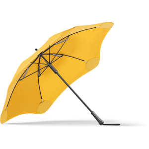 A yellow umbrella with a black frame, featuring a sleek design and a logo on the handle.