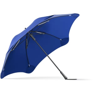 A blue umbrella with a sturdy frame and a designed canopy. It features a logo on the handle.