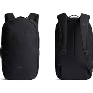 A black backpack with adjustable straps and a sleek design, featuring a logo and multiple zippered compartments.