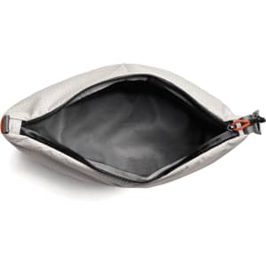 A grey cooler bag with a zipped opening, featuring a black interior and a small logo.