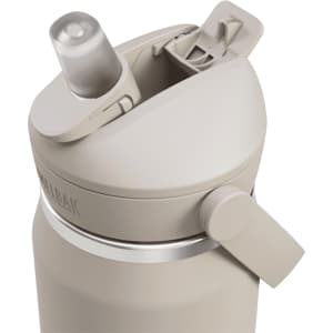 A drink bottle in a beige colour features a flip straw lid and a side lever for easy opening. It has a logo.