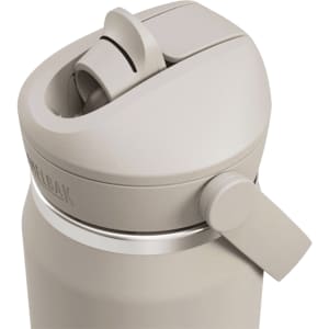 A drink bottle with a flip straw, featuring a muted beige colour and a logo on the side.