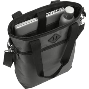 A black laptop tote bag with a grey laptop and a drink bottle inside. The bag features dual handles and a logo.