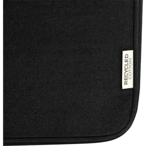 A black laptop sleeve made of recycled canvas with a textured finish and a small tag.