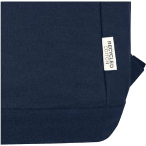 A navy blue laptop backpack with a label indicating it is made from recycled cotton.