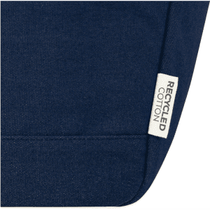 A dark blue recycled cotton tote with a label indicating it is made from recycled materials.