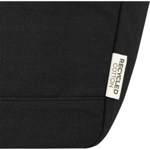 A black cooler tote featuring a recycled cotton label and a simple, sleek design.