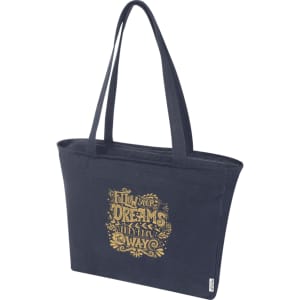 A navy zip tote bag with a gold graphic design and sturdy handles, featuring a logo.