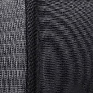 A close-up of textured fabric in dark grey and black, showcasing a layered design.