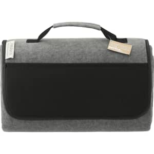 A grey oversized picnic rug with a black handle and front pocket, featuring a logo.