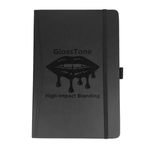 A black pocket-bound journal with an elastic band and an embossed logo on the cover.