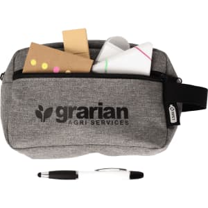 A grey stationery pouch with a logo, containing sticky notes, paper, and a black and white pen.