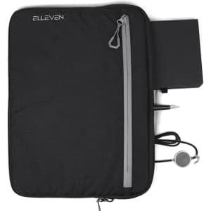 A black organiser featuring a zip pocket, a notebook, a pen, and a cord for headphones. It has a logo.