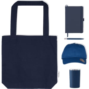 A navy tote bag, blue cap, notebook, pen, and drink tumbler, all featuring branding.