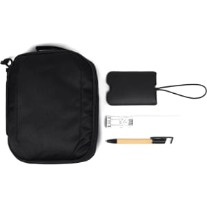 A black travel pack containing a pouch, pen, USB, and a card holder, featuring a simple design with a logo.