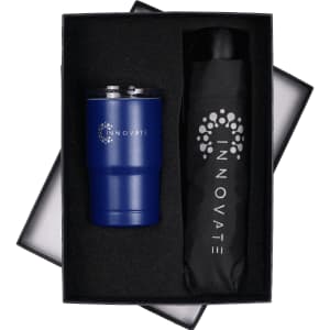 A drink bottle and a black umbrella in a black gift box, featuring a logo on both items. The tumbler is blue.