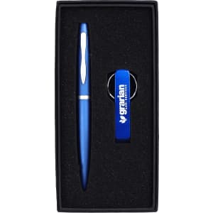 A blue pen and blue bottle opener keyring set presented in a sleek black gift box with a logo.