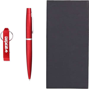 A drink bottle opener keyring and a red pen are displayed alongside a black gift box. The set includes branding.