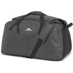 A large, dark grey duffel bag with dual handles and a removable shoulder strap, featuring a logo.