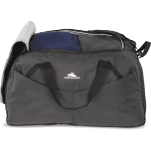 A grey duffel bag with a blue and grey top compartment, featuring two side pockets and a logo.