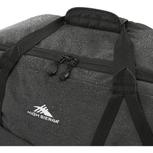 A black duffel bag with a textured finish, featuring zippers and a logo. Ideal for carrying personal items.