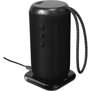 A black, cylindrical outdoor Bluetooth speaker with a textured surface and a handle, positioned on a charging dock.