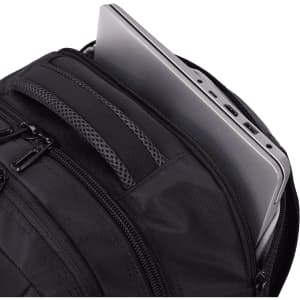 A black backpack with multiple zippered compartments, featuring a grey laptop partially stored inside.