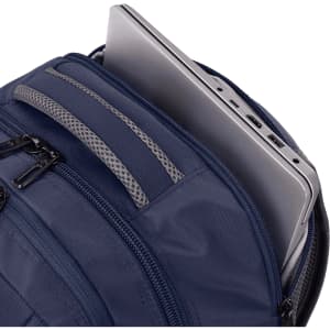 A navy backpack with multiple zippered compartments, featuring a laptop partially visible in one pocket.