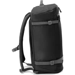 A black travel backpack with adjustable straps and a zippered compartment, featuring a simple design and branding.