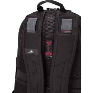 A black backpack with padded mesh straps and a logo on the back. It features adjustable straps and zippers.